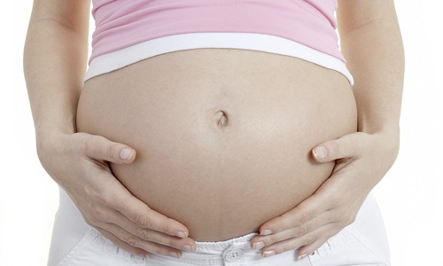 З якої причини коліт внизу живота при вагітності?